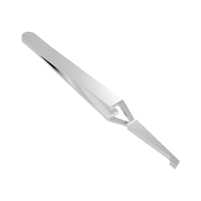 Clear plastic tool on a gray background