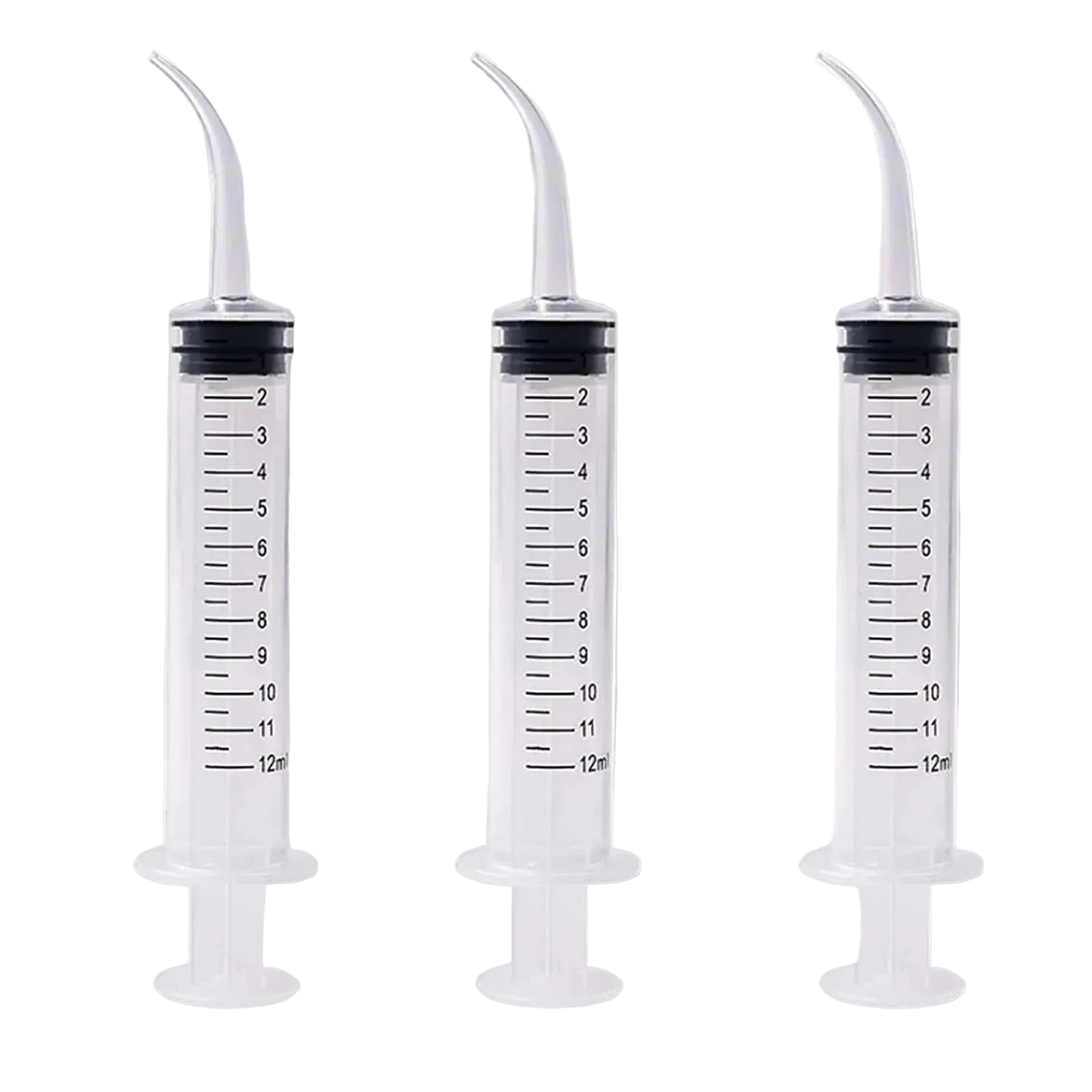 Three plastic syringes with measurement markings on a gray background